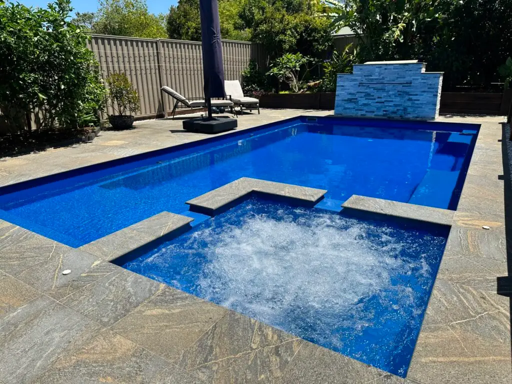 Blue swimming pool with spa bubbles on the Sunshine Coast