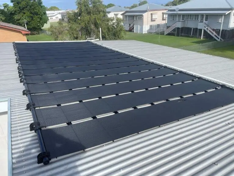 Gulfstream solar pool heating panels installed on roof from side angle